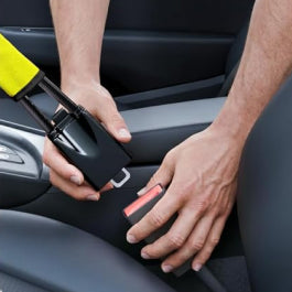 Click into the seat belt buckle